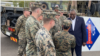 U.S. Secretary of Defense Lloyd Austin, right, visits troops taking part in Exercise Talisman Sabre in Townsville, Australia. "We are grateful for everything that you are doing," he said.