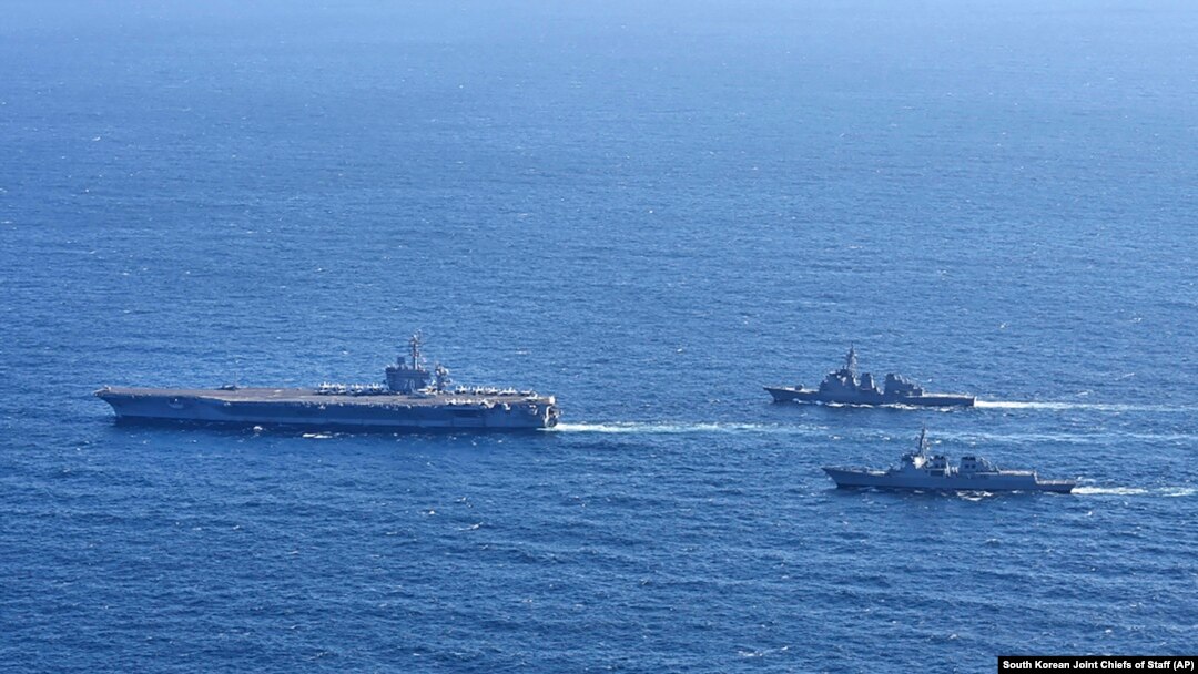 In this photo provided by the South Korean Joint Chiefs of Staff, the USS Carl Vinson, left, sails with South Korean Navy's Aegis destroyer King Sejong the Great, and Japan's Maritime Self-Defense Force Aegis destroyer Kongou during a 2024 joint drill.