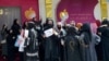 FILE - Afghan women stage a protest for their rights at a beauty salon in the Shahr-e-Naw area of Kabul on July 19, 2023. 