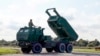 A High-Mobility Artillery Rocket System (HIMARS ) in operation during military exercises at Spilve Airport in Riga, Latvia, Sept. 26, 2022. 