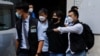 FILE - Founder of the Student Politicism group Wong Yat Chin is detained by police, in Hong Kong, Sept. 20, 2021. 