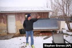 This Dec. 11, 2019, photo shows Henry Red Cloud, who teaches renewable energy installation on Pine Ridge Reservation in South Dakota.