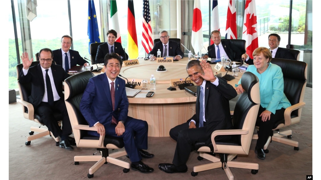 Japanese Prime Minsiter Shinzo Abe, foreground center left, and U.S. President Barack Obama, foreground center right, smile at photographers with other leaders of Group of Seven industrial nations, clockwise from left, French President Francois Hollande,