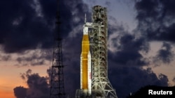 FILE - NASA’s next-generation moon rocket, the Space Launch System (SLS) Artemis 1, is shown at the Kennedy Space Center in Cape Canaveral, Florida, June 27, 2022.