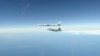 FILE - This NORAD handout photo shows North American Aerospace Defense Command F-22 Raptors as they successfully completed two intercepts of Russian bomber aircraft formations entering the Alaskan Air Defense Identification Zone on June 16, 2020.