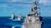 In this photo from the Defense Visual Information Distribution Service, a ship from Japan's Maritime Self-Defense Force sails during MALABAR 2021 on Aug. 27, 2021. The U.S., India and Australia also participated in the exercise, held in the Philippine Sea and Bay of Bengal.