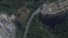 2022年12月26日，衛星圖片顯示廣州市番禺區殯儀館外車輛集結（來源：Planet Labs PBC)