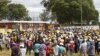 Amalunga ebandla leCitizens Coalition for Change aliswa ngamapholisa ukuba angene enkundleni yemidlalo eMarondera ngesikhathi ibandla leli likhankasela ukhetho lwama by-elections olwenziwe ngeviki ephelileyo. (Columbus Mavhunga)