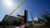 Flowers sit outside crime scene tape at Geneva Presbyterian Church on May 17, 2022, in Laguna Woods, Calif. A shooting at the church on May 15, 2022, left one dead and five injured. AP Photo.