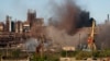 FILE - Smoke rises from the Metallurgical Combine Azovstal in Mariupol during shelling, in Mariupol, in eastern Ukraine, May 7, 2022.