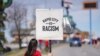 Native American woman participating in NDN Collective protest against racist businesses in Rapid City, S.D., April 20, 2022. 