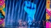FILE - Ukrainian band Kalush Orchestra performs on stage during the 2022 MTV Europe Music Awards in Düsseldorf, Germany, Nov. 13, 2022.