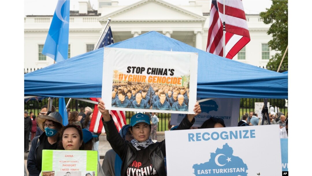 FILE - East Turkistan Awakening Movement holds a rally outside the White House against alleged oppression of Uyghurs in far-western Xinjiang province by the Chinese government, to coincide with the 73rd National Day of the People's Republic of China in Washington, Oct. 1, 2022.