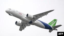 A Commercial Aircraft Corp of China (COMAC) C919 aircraft, China's first domestically produced large passenger jet, performs during the Airshow China 2022 in Zhuhai, in southern China's Guangdong province on November 8, 2022. (Photo by CNS /AFP)