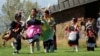 Hopi children dance in front of City Hall on Indigenous Peoples Day in Flagstaff, Ariz., Monday, Oct. 10, 2022.