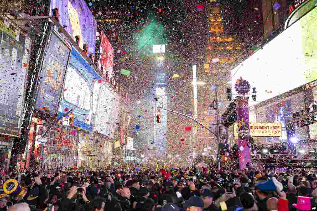 Confetti falls at midnight on the Times Square New Year's Eve celebration, in New York.