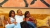 President Barack Obama and his daughters, Malia (l) and Sasha, watch on TV as First Lady Michelle Obama delivers her speech at the Democratic National Convention, Sept. 4, 2012. (Official White House Photo by Pete Souza)