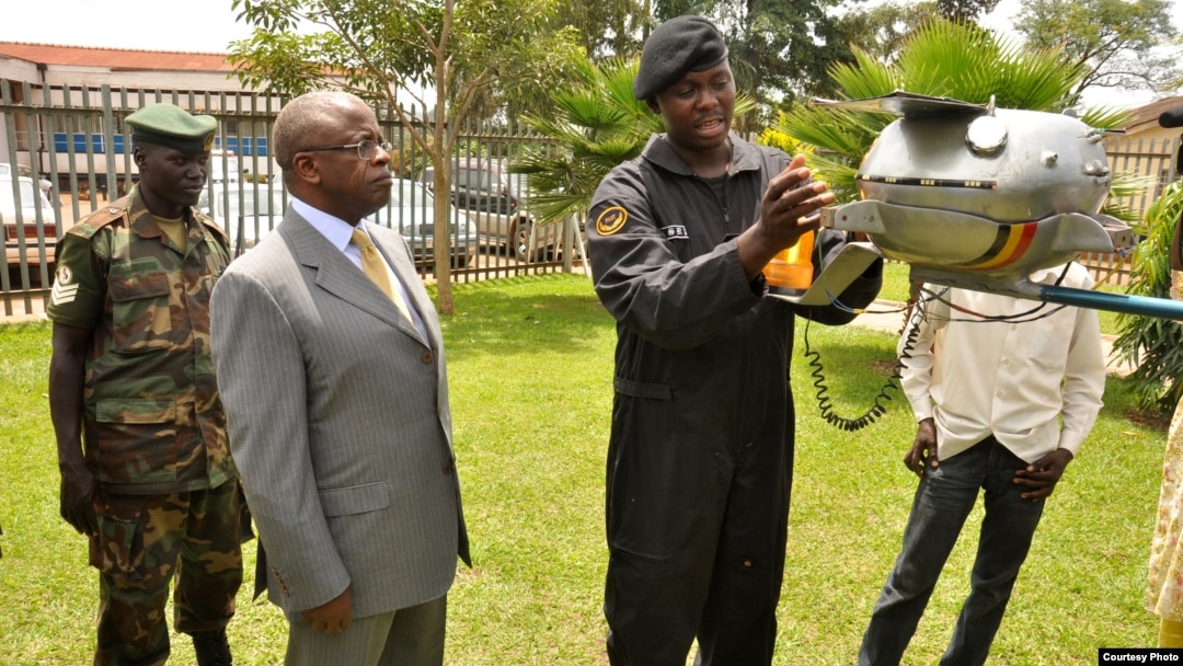 Ugandan Prime Minister Amama Mbabazi inspects Chris Nsamba's space probe in March, 2013. (Photo: African Space Research Program)