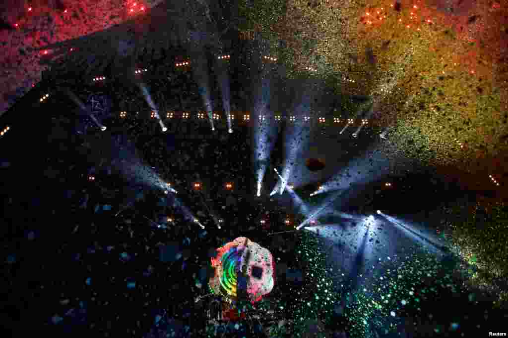 Coldplay perform on the Pyramid stage at Worthy Farm in Somerset during the Glastonbury Festival, Britain, June 26, 2016.