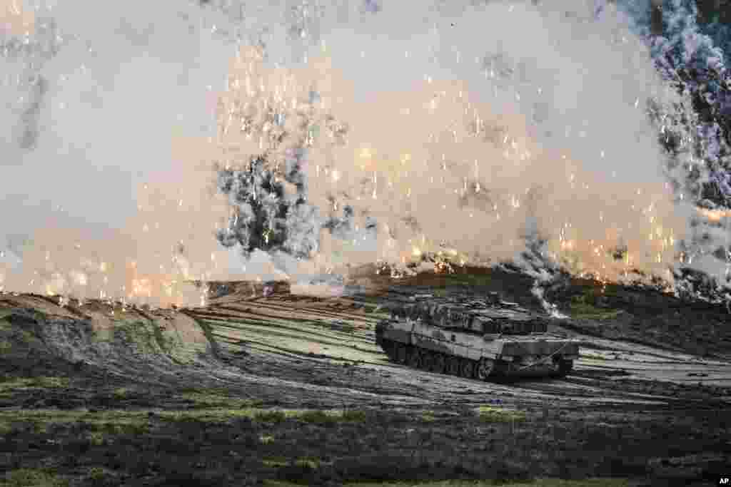 A Leopard 2 tank is seen in action during a visit of German Defense Minister Boris Pistorius at the Bundeswehr tank battalion 203 at the Field Marshal Rommel Barracks in Augustdorf, Germany.