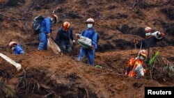 Rescue workers work at the site where a China Eastern Airlines Boeing 737-800 plane flying from Kunming to Guangzhou crashed, in Wuzhou, Guangxi Zhuang Autonomous Region, China, March 24, 2022. 