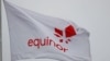 FILE - Equinor's flag flutters next to the company's headqurters in Stavanger, Norway, Dec. 5, 2019.