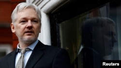 FILE - WikiLeaks founder Julian Assange makes a speech from the balcony of the Ecuadorian Embassy in central London, Britain, Feb. 5, 2016. 