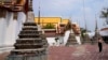 FILE - A tourist visits Wat Pho temple in Bangkok, Thailand, Feb. 23, 2022. Thailand’s economy, heavily dependent upon tourism, is forecast to grow 3.6% in 2023, the World Bank reported.