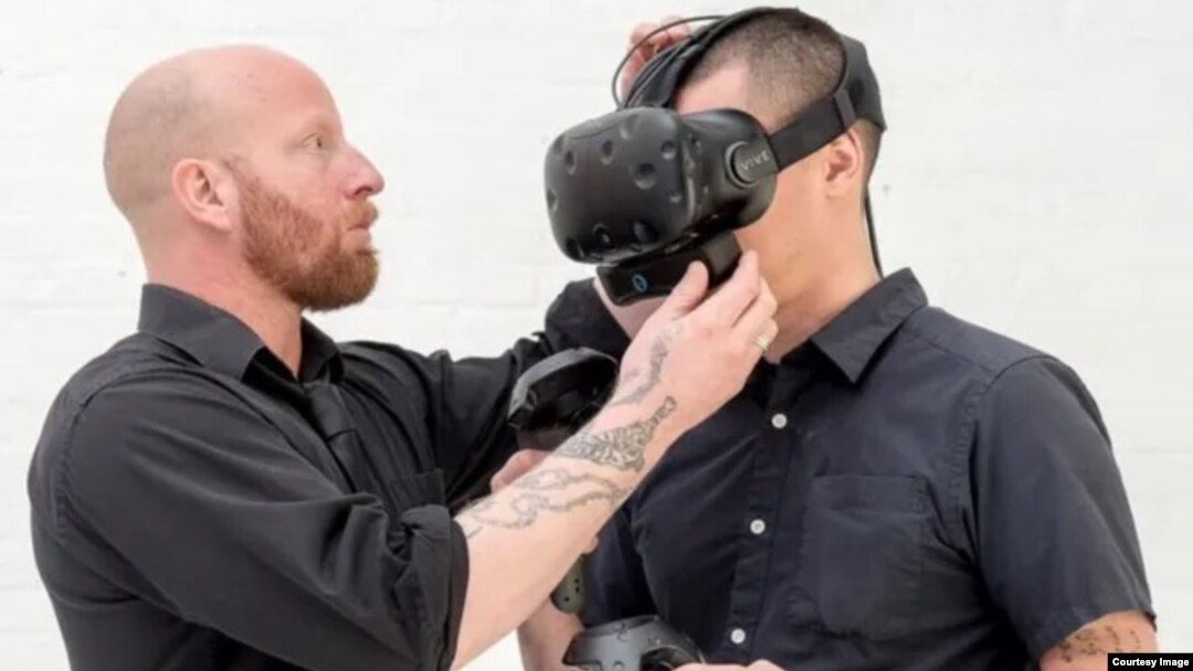 The head of OVR Technology, Aaron Wisniewski demonstrates a virtual reality wearable device designed to produce realistic smells. (Image Credit: OVR Technology)