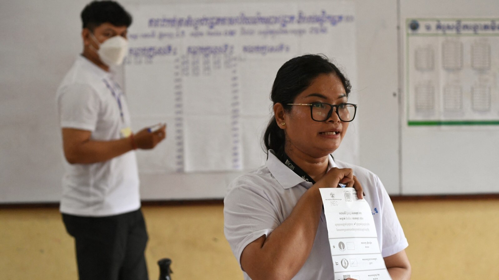 Cambodian election officials count ballots at a polling station during local commune elections in Phnom Penh, June 5, 2022. 