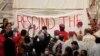 Indigenous Canadians display a banner calling on Pope to rescind the Doctrine of Discovery in Quebec City, Canada, Thursday, July 28, 2022.