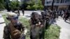 U.S. Army members form a police line on 16th Street as demonstrators gather to protest the death of George Floyd, Wednesday, June 3, 2020, near the White House in Washington. Floyd died after being restrained by Minneapolis police officers. (AP…