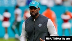FILE - Miami Dolphins head coach Brian Flores runs off the field after winning a game against the New York Jets at Hard Rock Stadium, in Miami Gardens, Florida, Dec 19, 2021. (USA Today Sports / via Reuters)