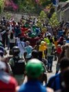 People displaced by gang violence march in protest of the gangs in Port-au-Prince, Haiti, on March 1, 2025. The aid group Doctors Without Borders said on March 6 that makeshift camps for the displaced are in danger of disease outbreaks.