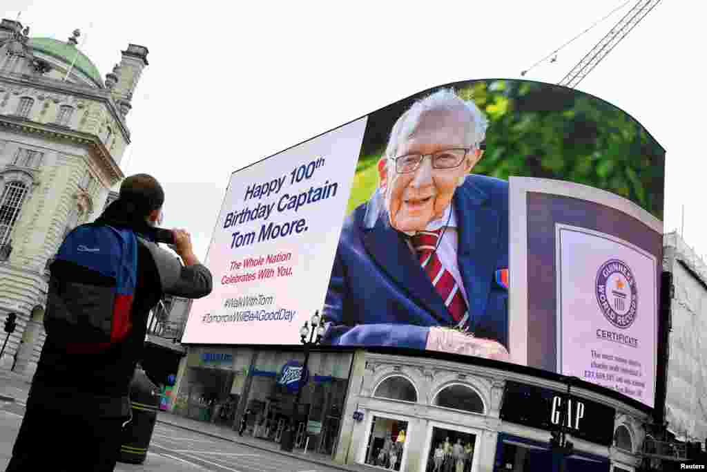 A happy birthday message is displayed on the big screen in Piccadilly Circus for army veteran Captain Tom Moore on his 100th birthday, in London, a gesture of appreciation for his fundraising achievements for the NHS.