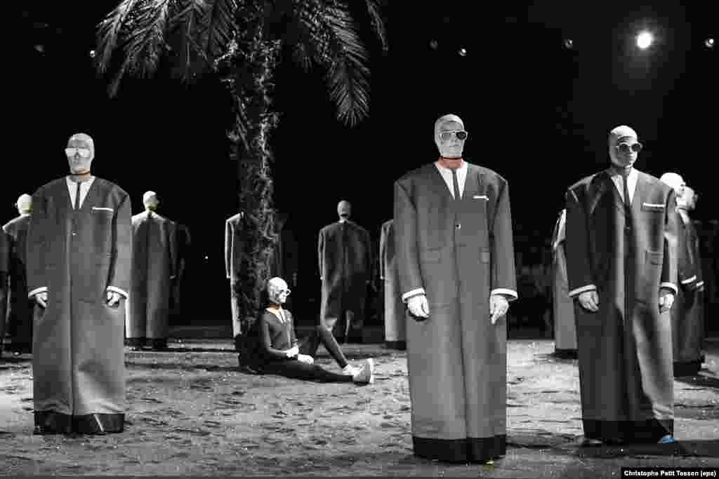 Models present creations of U.S. designer Thom Browne, during Paris Fashion Week, in Paris, France, 26 June 2016.