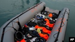 A dinghy with floats and life-vests of migrants, intercepted aboard of it off the coast in the Mediterranean Sea.