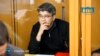 In this photo released by the Kazakhstan Supreme Court Press Office’s Telegram channel on April 12, 2024, businessman Kuandyk Bishimbayev, the country’s former economy minister, sits in a defendants’ cage at his trial in Astana, Kazakhstan.