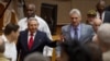 Cuba's President Raul Castro (C-L) and First Vice-President Miguel Diaz-Canel (C-R) arrive for a session of the National Assembly in Havana, Cuba, April 18, 2018. Diaz-Canel was named to succeed Castro Thursday.