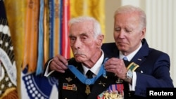 U.S. President Joe Biden awards the Medal of Honor to U.S. Army veteran Maj. John Duffy, in the East Room at the White House in Washington, U.S., July 5, 2022. 