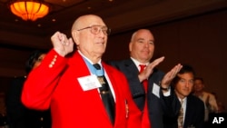 FILE - Medal of Honor recipient Hershel "Woody" Williams, front, reacts as he is introduced during the 2012 Medal of Honor luncheon presented by the National Foundations of Patriotism in Atlanta, May 11, 2012. Williams died June 29, 2022, in Huntington, W. Va. He was 98.