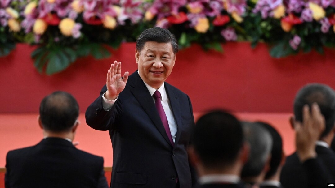 China's President Xi Jinping waves following his speech after a ceremony to inaugurate the city's new leader and government in Hong Kong on July 1, 2022, on the 25th anniversary of the city's handover from Britain to China.