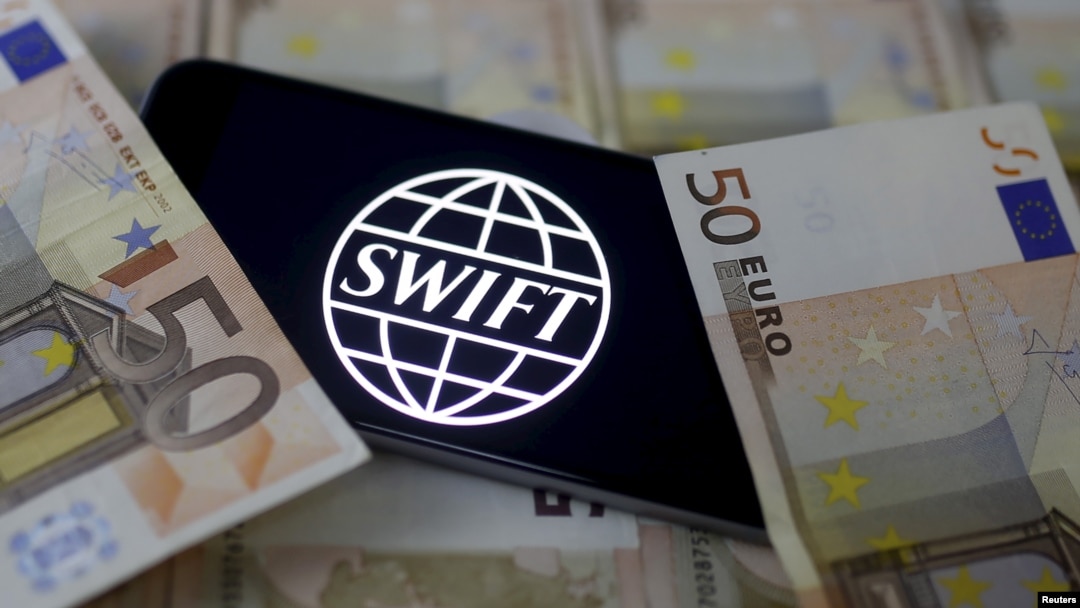 Swift code bank logo is displayed on an iPhone 6s on top of Euro banknotes in this picture illustration made in Zenica, Bosnia and Herzegovina on January 26, 2016.