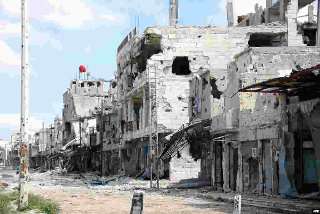 A handout picture released by the Syrian Arab News Agency shows destruction in the Baba Amr district of Homs, March 27, 2013.