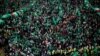 FILE - Palestinian Hamas supporters take part in a rally marking the 30th anniversary of Hamas' founding, in Gaza City, Dec. 14, 2017. 