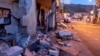 Debris of a partially collapsed house sit on the street in Fleri, Sicily, Dec. 26, 2018. 