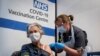 Dr Doreen Brown, 85, receives the first of two Pfizer/BioNTech COVID-19 vaccine jabs administered at Guy's Hospital in London, Dec. 8, 2020. 