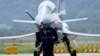 FILE - A Chinese J-10 fighter jet is being guided on the tarmac following a flight demonstration at China's 13th International Aviation and Aerospace Exhibition, in Zhuhai, in southern China's Guangdong province, Sept. 28, 2021. 