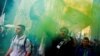 Italian League (Lega) supporters hold flares as they arrive at political rally led by leader Matteo Salvini, in Milan, Italy, Feb. 24, 2018.