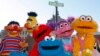 FILE - Characters from "Sesame Street Live" appear on the street by Madison Square Garden to celebrate the 30th anniversary of the live touring stage shows based on the PBS television series in New York, Feb. 4, 2010. The nonprofit behind TV's "Sesame Street" is using the Muppets to entertain and instruct kids who've known nothing but war in the Mideast.